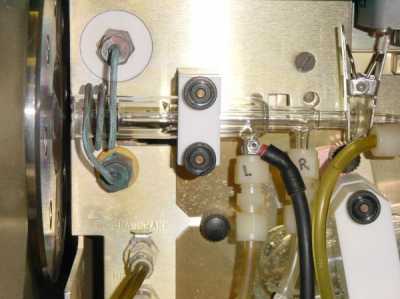 The three nested glass tubes that contain the plasma in the ICP-MS. The vaporised sample passes from the right side through the plasma and into the mass spectrometer on the left.