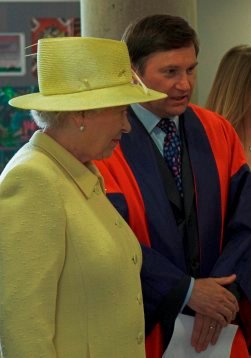 Professor John Barrow, MMP Director, explains Roadshow activities to the Queen in June