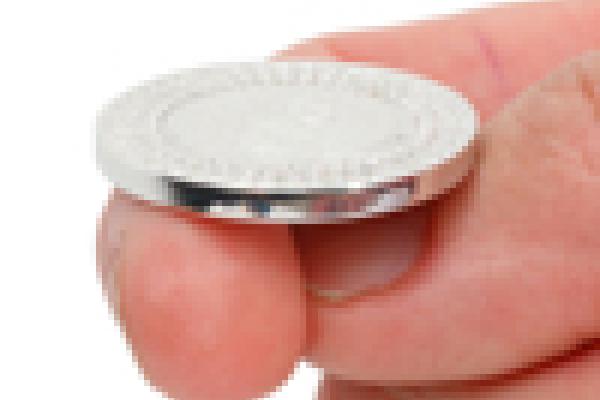 Someone about to flip a coin