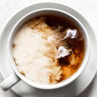 Milk being mixed into tea